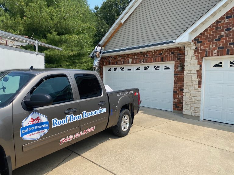roof bros restoration branded truck 005 - Roof Bros Restoration - roofing gallery wisconsin illinois A tan Roof Bros Restoration branded pickup truck displaying the phone number (844) 314-ROOF is parked in a driveway in fro...