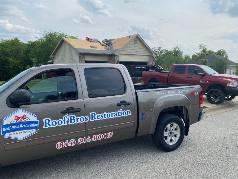 roof bros restoration branded truck 007 - Roof Bros Restoration - roofing gallery wisconsin illinois A tan Chevrolet pickup truck with 'Roof Bros Restoration' and '(844) 314-ROOF' graphics on the driver-side door parked in...