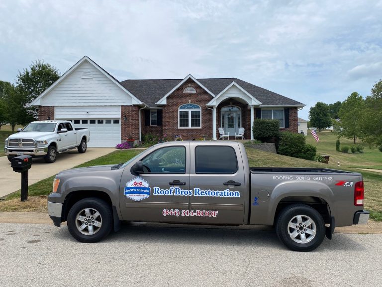 roof bros restoration branded truck 008 - Roof Bros Restoration - roofing gallery wisconsin illinois A tan Roof Bros Restoration pickup truck displaying (844) 314-ROOF and 'ROOFING SIDING GUTTERS' is parked in the street in...