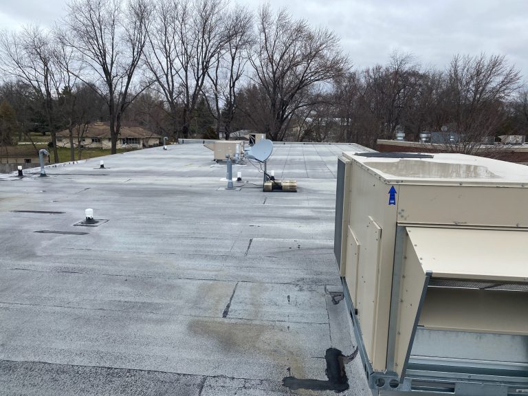 roof bros restoration illinois commercial flat roof 001 - Roof Bros Restoration - roofing gallery wisconsin illinois A commercial flat roof with white modified-bitumen or TPO membrane, an HVAC rooftop unit at right, satellite dishes and ro...