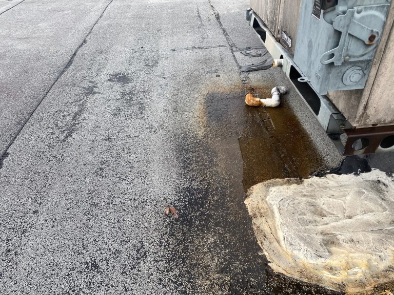 roof bros restoration illinois commercial roof leak 005 2 - Roof Bros Restoration - roofing gallery wisconsin illinois A close-up of a flat roof membrane near an HVAC unit showing brown water staining, a drain pipe, and exposed insulation ma...