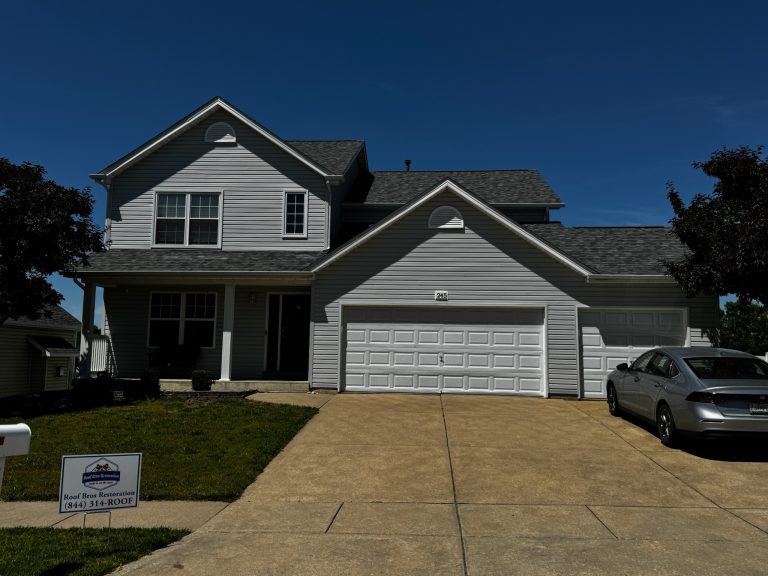 roof bros restoration illinois completed roof 006 - Roof Bros Restoration - roofing gallery wisconsin illinois A two-story home with light gray siding, white trim, and a two-car garage has a Roof Bros Restoration (844) 314-ROOF yard...
