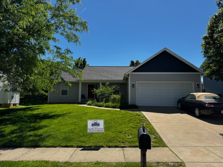 roof bros restoration illinois completed roof 012 - Roof Bros Restoration - roofing gallery wisconsin illinois Single-story ranch-style home with white siding and dark gable accents, two-car attached garage, gold sedan in the drivewa...