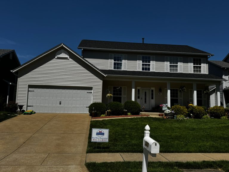 roof bros restoration illinois completed roof 013 - Roof Bros Restoration - roofing gallery wisconsin illinois Two-story residential home with white vinyl siding, dark shingle roof, two-car attached garage, covered front porch with h...