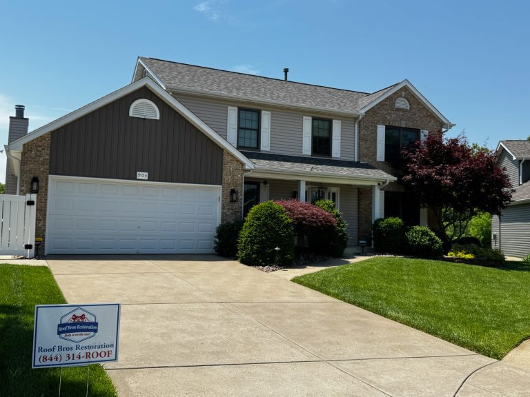 roof bros restoration illinois completed roof 019 - Roof Bros Restoration - roofing gallery wisconsin illinois Two-story residential home with brick lower facade, brown and tan siding, dark shingle roof, two-car attached garage, and...