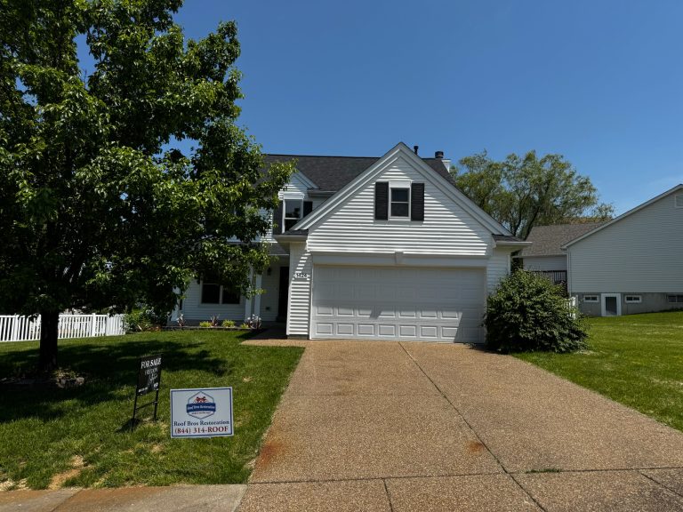 roof bros restoration illinois completed roof 024 - Roof Bros Restoration - roofing gallery wisconsin illinois Two-story residential home with white vinyl siding, dark shutters, two-car attached garage, dark shingle roof, and a Roof...