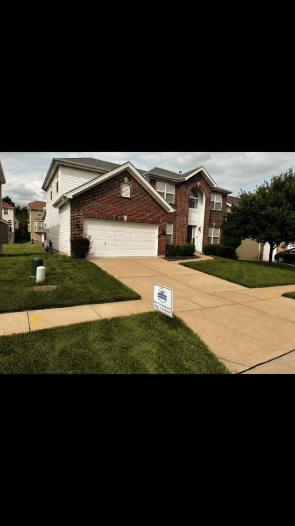 roof bros restoration video poster beloit wi completed roof 001 - Roof Bros Restoration - roofing gallery wisconsin illinois Exterior view of a two-story brick and white-sided suburban home with attached garage, green lawn, and a small Roof Bros R...