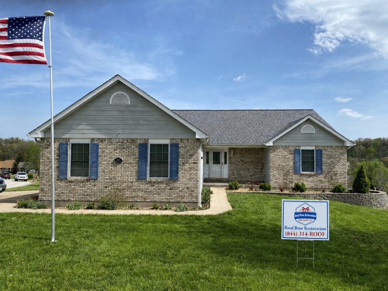 roof bros restoration yard sign 003 - Roof Bros Restoration - roofing gallery wisconsin illinois A one-story brick ranch home with blue shutters and a new gray asphalt-shingle roof, with a Roof Bros Restoration yard sig...